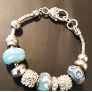 Bali Style Rhinestone and
Silver Accent Charm
Bracelet